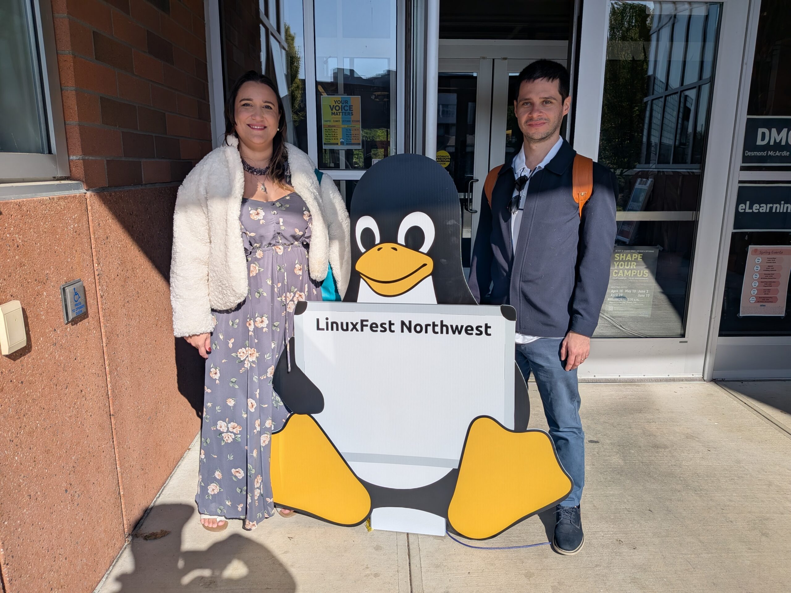 Blind Penguin team poses next to Tux (Linux Mascot) on Linux Fest Northwest
